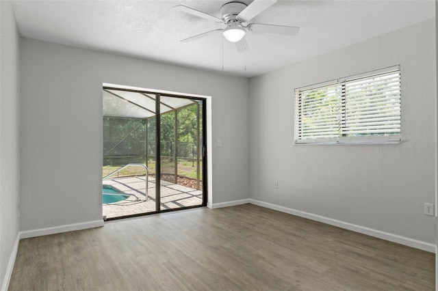 2152 Danforth Rd, Spring Hill, FL 34608 - spare room with a ceiling fan, wood finished floors, and a sunroom