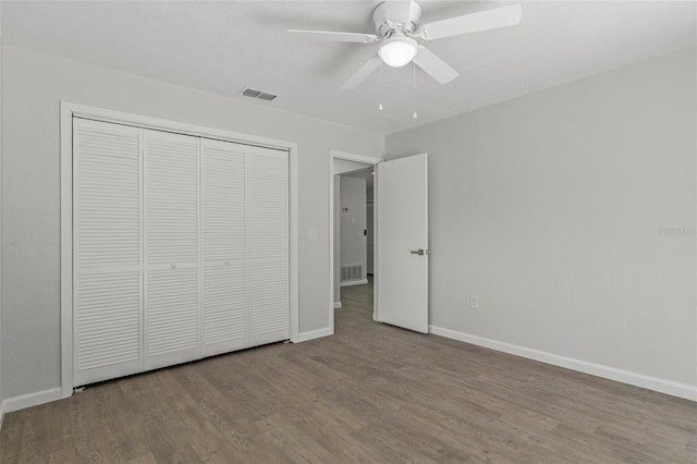 2152 Danforth Rd, Spring Hill, FL 34608 - unfurnished bedroom featuring wood finished floors, a closet, and a ceiling fan