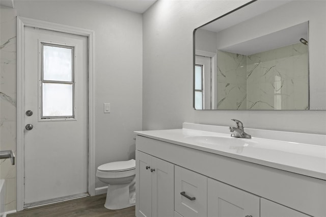 2152 Danforth Rd, Spring Hill, FL 34608 - bathroom featuring vanity, wood finished floors, a marble finish shower, and a tub to relax in