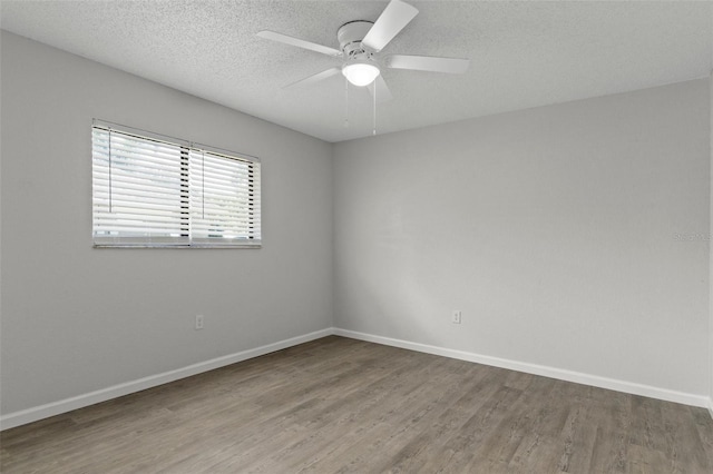 2152 Danforth Rd, Spring Hill, FL 34608 - spare room with wood finished floors, ceiling fan, and a textured ceiling