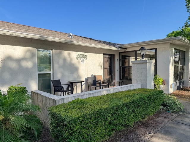 8130 Bugle Ct Unit 3, Port Richey, FL 34668 - view of exterior entry with stucco siding