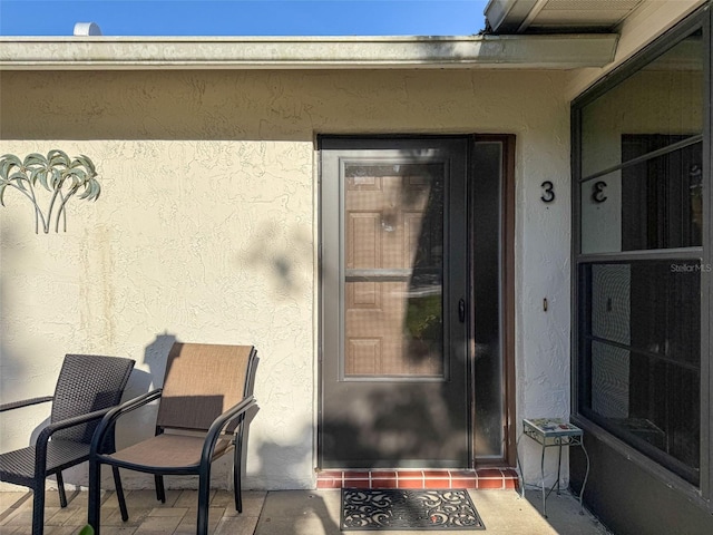 8130 Bugle Ct Unit 3, Port Richey, FL 34668 - property entrance with stucco siding