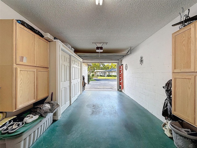 8130 Bugle Ct Unit 3, Port Richey, FL 34668 - garage with a garage door opener and concrete block wall