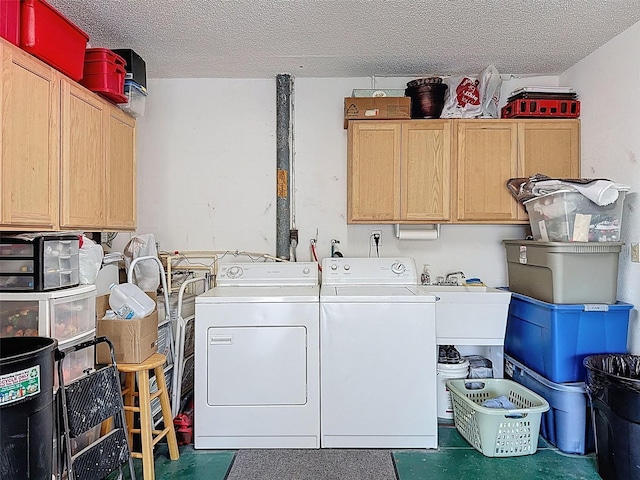 8130 Bugle Ct Unit 3, Port Richey, FL 34668 - laundry area with washer and clothes dryer, cabinet space, and a textured ceiling
