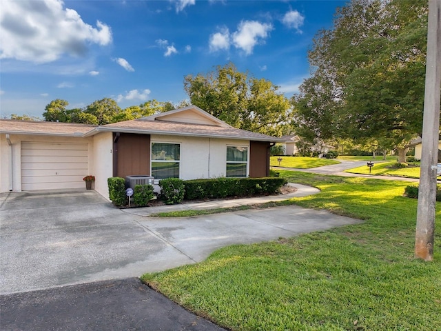 8130 Bugle Ct Unit 3, Port Richey, FL 34668 - ranch-style home with driveway, a front yard, an attached garage, and stucco siding