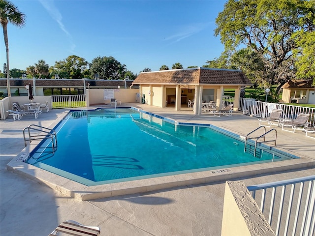 8130 Bugle Ct Unit 3, Port Richey, FL 34668 - community pool featuring a patio area