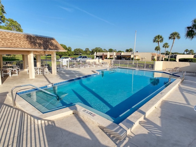 8130 Bugle Ct Unit 3, Port Richey, FL 34668 - community pool featuring a patio area