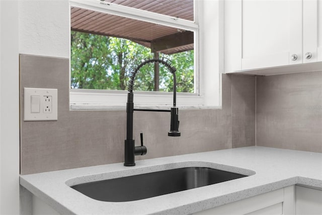 7192 Catalina St, Spring Hill, FL 34606 - kitchen view of white cabinetry and light stone counters