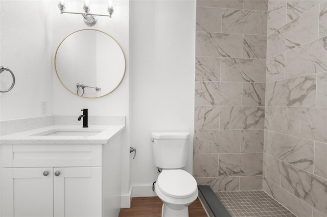 7192 Catalina St, Spring Hill, FL 34606 - bathroom with vanity, wood finished floors, and a tile shower