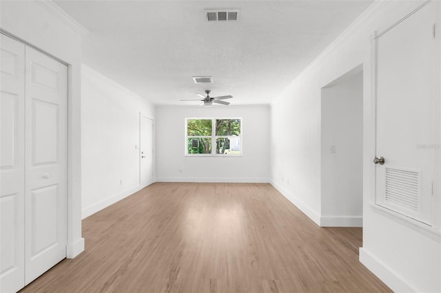 7192 Catalina St, Spring Hill, FL 34606 - spare room featuring ceiling fan, light wood-style floors, and ornamental molding