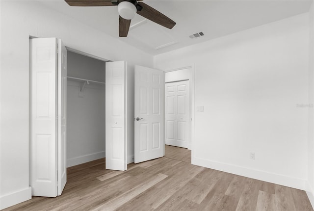 7192 Catalina St, Spring Hill, FL 34606 - unfurnished bedroom featuring light wood finished floors, a closet, and a ceiling fan
