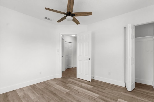 7192 Catalina St, Spring Hill, FL 34606 - unfurnished bedroom featuring light wood-style flooring, a closet, and ceiling fan