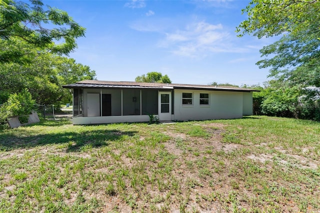 7192 Catalina St, Spring Hill, FL 34606 - rear view of house with a sunroom