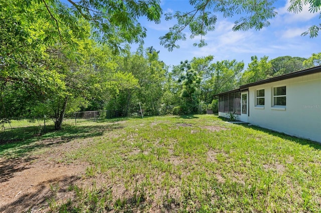 7192 Catalina St, Spring Hill, FL 34606 - fenced backyard featuring a sunroom