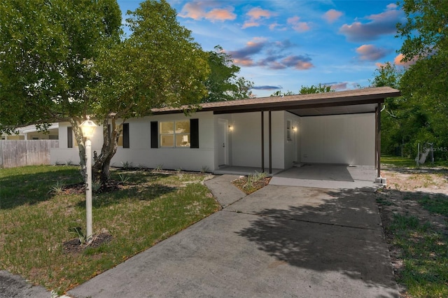 7192 Catalina St, Spring Hill, FL 34606 - view of front facade with driveway and an attached carport