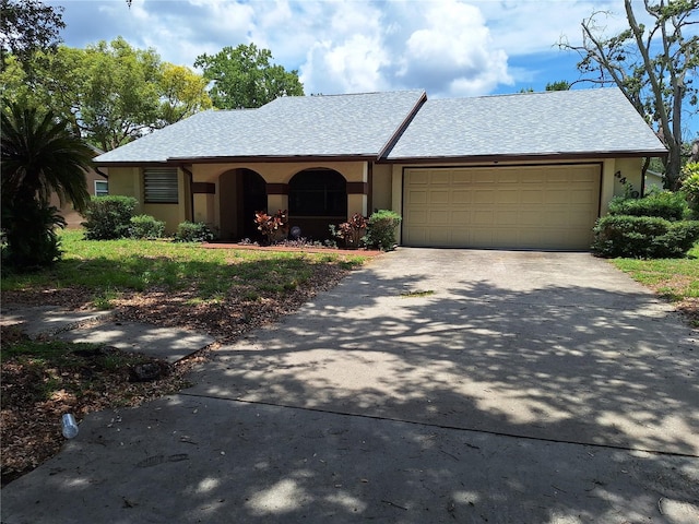 4420 Sawgrass Blvd, New Port Richey, FL 34653 - view of front of property featuring concrete driveway, a garage, and stucco siding