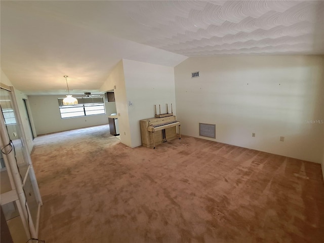 4420 Sawgrass Blvd, New Port Richey, FL 34653 - spare room featuring lofted ceiling and light colored carpet