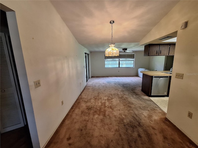 4420 Sawgrass Blvd, New Port Richey, FL 34653 - unfurnished dining area with a chandelier and carpet