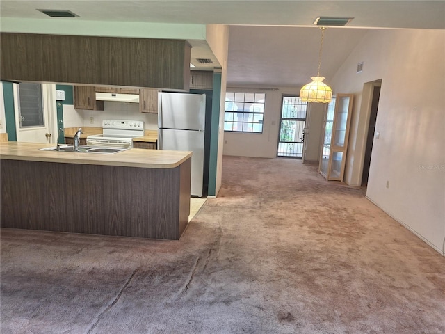 4420 Sawgrass Blvd, New Port Richey, FL 34653 - kitchen featuring freestanding refrigerator, white electric stove, light carpet, light countertops, and decorative light fixtures