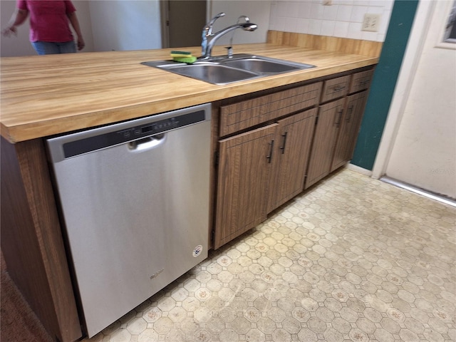 4420 Sawgrass Blvd, New Port Richey, FL 34653 - kitchen with dishwasher, backsplash, and butcher block counters