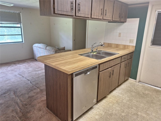 4420 Sawgrass Blvd, New Port Richey, FL 34653 - kitchen with stainless steel dishwasher and backsplash