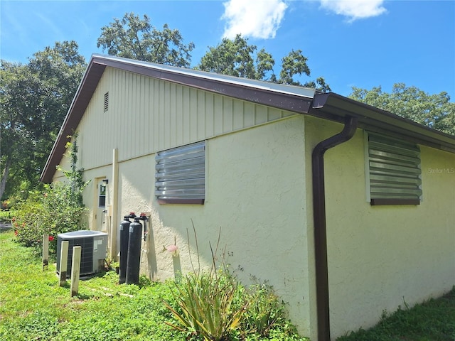 4420 Sawgrass Blvd, New Port Richey, FL 34653 - view of property exterior with a cooling unit and stucco siding