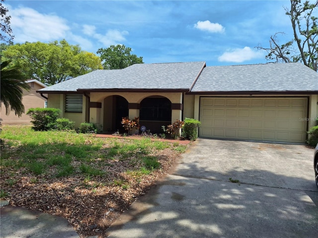 4420 Sawgrass Blvd, New Port Richey, FL 34653 - view of front of property featuring driveway, a garage, stucco siding, and a shingled roof