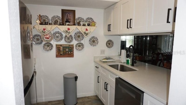 5434 Chad Pl Unit 14, New Port Richey, FL 34652 - kitchen featuring dishwasher, white cabinets, and light countertops