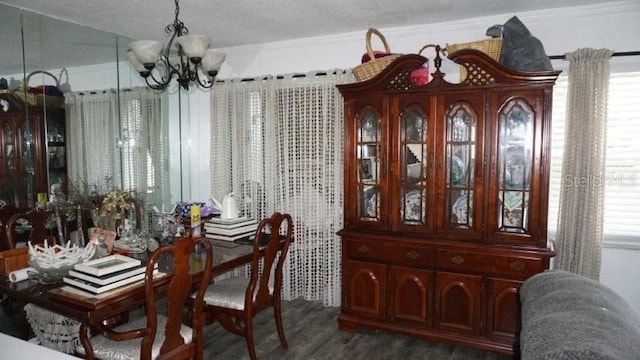 5434 Chad Pl Unit 14, New Port Richey, FL 34652 - dining space with a chandelier and dark wood finished floors