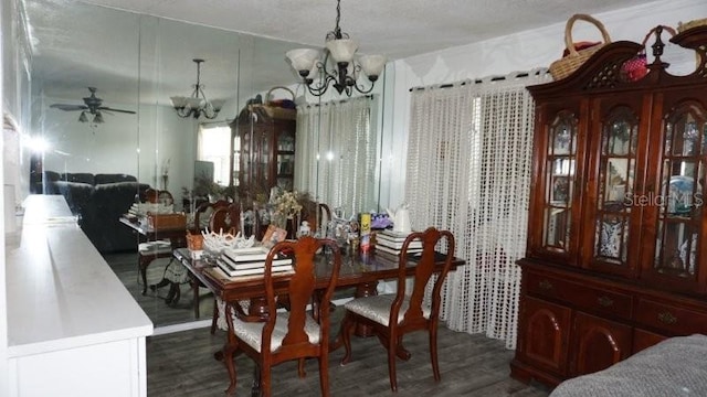 5434 Chad Pl Unit 14, New Port Richey, FL 34652 - dining space featuring a chandelier, dark wood finished floors, and ceiling fan