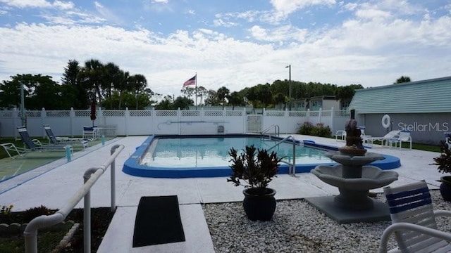 5434 Chad Pl Unit 14, New Port Richey, FL 34652 - community pool featuring a patio