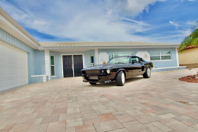 5339 Bowline Bnd, New Port Richey, FL 34652 - garage featuring decorative driveway