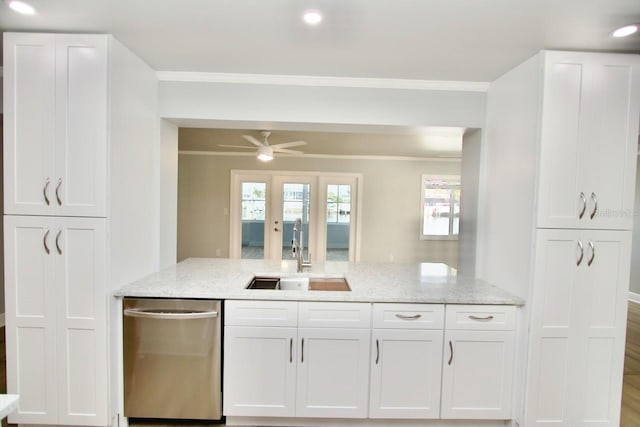 5339 Bowline Bnd, New Port Richey, FL 34652 - kitchen featuring stainless steel dishwasher, crown molding, white cabinetry, light stone counters, and recessed lighting