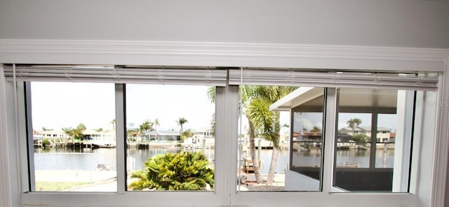5339 Bowline Bnd, New Port Richey, FL 34652 - doorway to outside with a water view and healthy amount of natural light