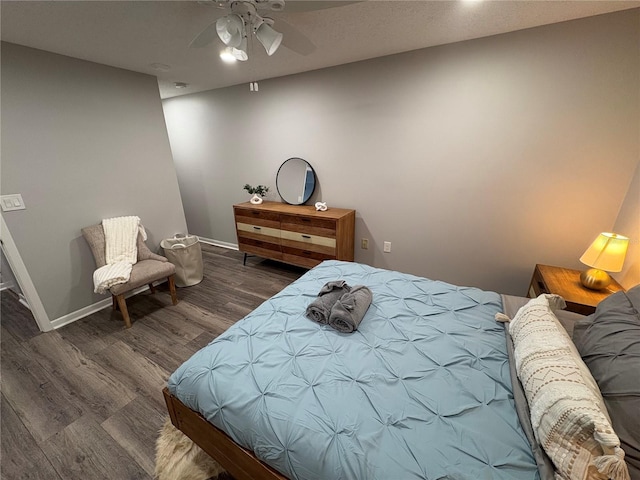 5555 Gulf Blvd Unit 315, St Pete Beach, FL 33706 - bedroom featuring wood finished floors and ceiling fan