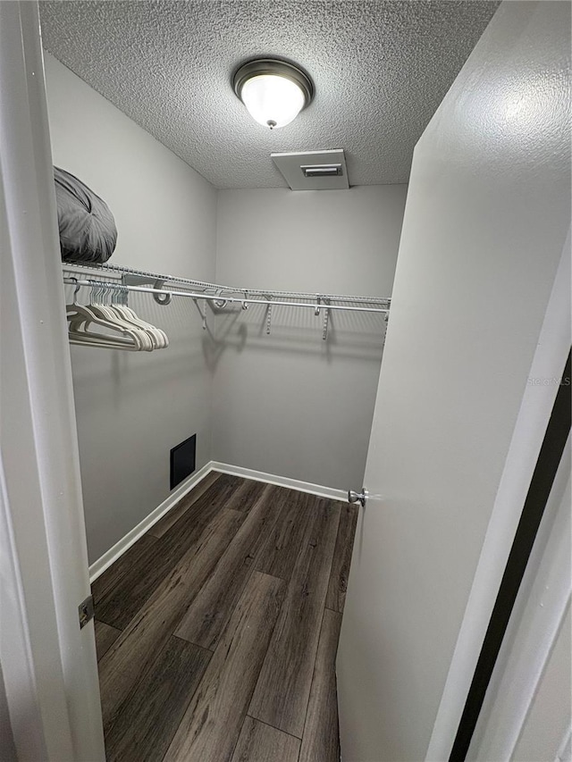5555 Gulf Blvd Unit 315, St Pete Beach, FL 33706 - spacious closet featuring dark wood finished floors