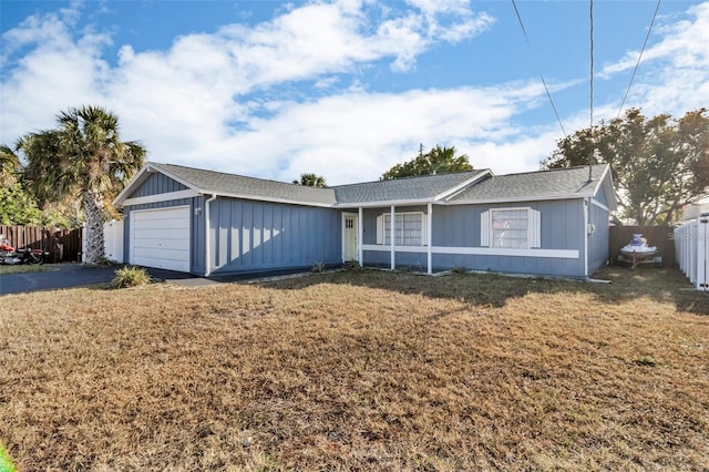 15950 Adobe Dr, Hudson, FL 34667 - ranch-style home with an attached garage, driveway, and roof with shingles