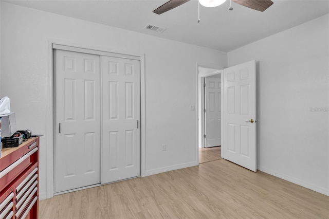 15950 Adobe Dr, Hudson, FL 34667 - unfurnished bedroom with light wood-type flooring, a closet, and ceiling fan