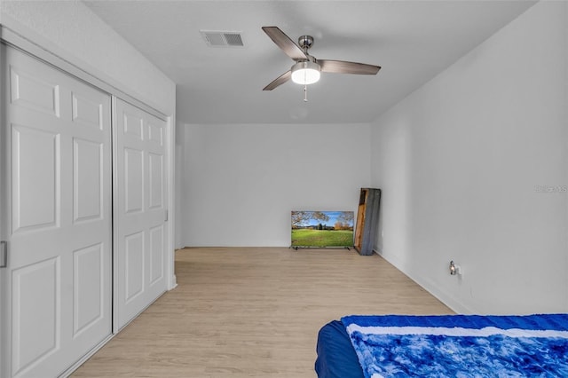 15950 Adobe Dr, Hudson, FL 34667 - bedroom featuring light wood finished floors and a ceiling fan