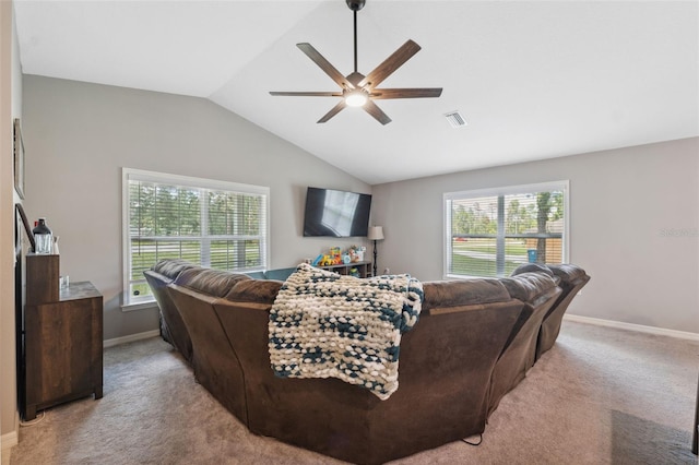11034 Flock Ave, Weeki Wachee, FL 34613 - living area featuring ceiling fan, healthy amount of natural light, light carpet, and vaulted ceiling