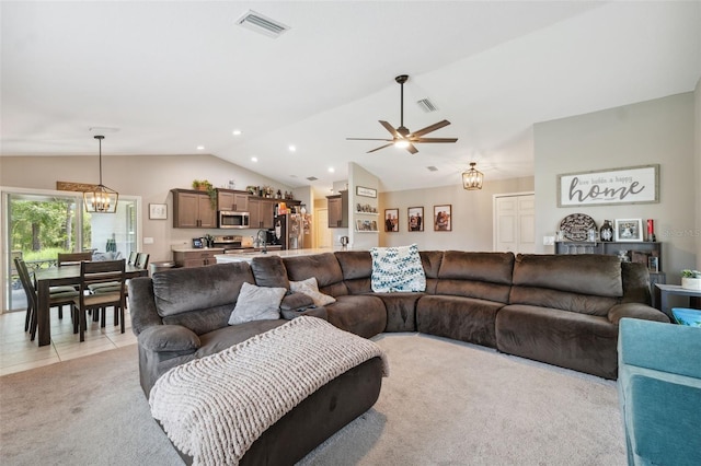 11034 Flock Ave, Weeki Wachee, FL 34613 - living room featuring lofted ceiling, ceiling fan, a chandelier, light carpet, and recessed lighting