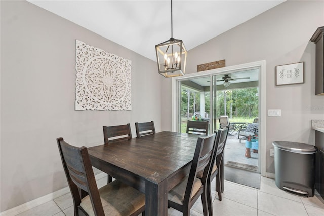 11034 Flock Ave, Weeki Wachee, FL 34613 - dining area with light tile patterned flooring, lofted ceiling, a chandelier, and a ceiling fan