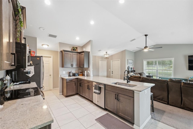 11034 Flock Ave, Weeki Wachee, FL 34613 - kitchen featuring stainless steel appliances, a peninsula, open floor plan, light tile patterned floors, and a ceiling fan