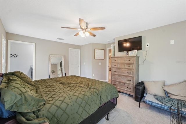 11034 Flock Ave, Weeki Wachee, FL 34613 - bedroom with light colored carpet and ceiling fan