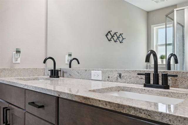 11034 Flock Ave, Weeki Wachee, FL 34613 - kitchen with dark brown cabinets and light stone counters