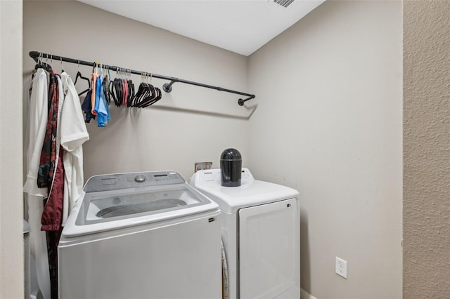 11034 Flock Ave, Weeki Wachee, FL 34613 - laundry room with washer and clothes dryer