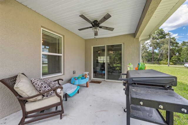 11034 Flock Ave, Weeki Wachee, FL 34613 - view of patio featuring grilling area and a ceiling fan