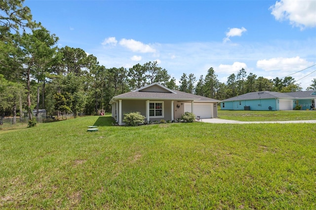 11034 Flock Ave, Weeki Wachee, FL 34613 - ranch-style house with a garage, driveway, a front yard, and stucco siding