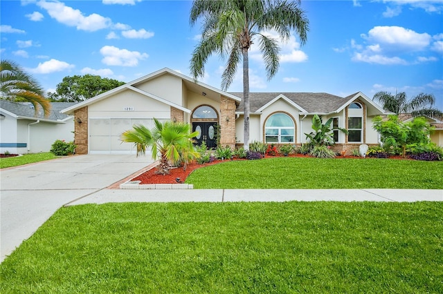 single story home featuring driveway, a garage, stucco siding, and brick siding