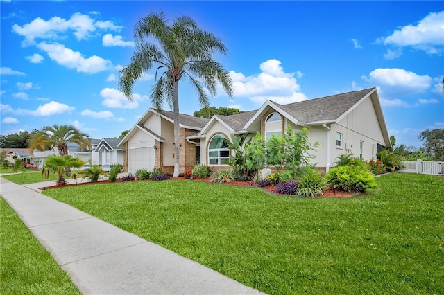 single story home featuring an attached garage, roof with shingles, and stucco siding